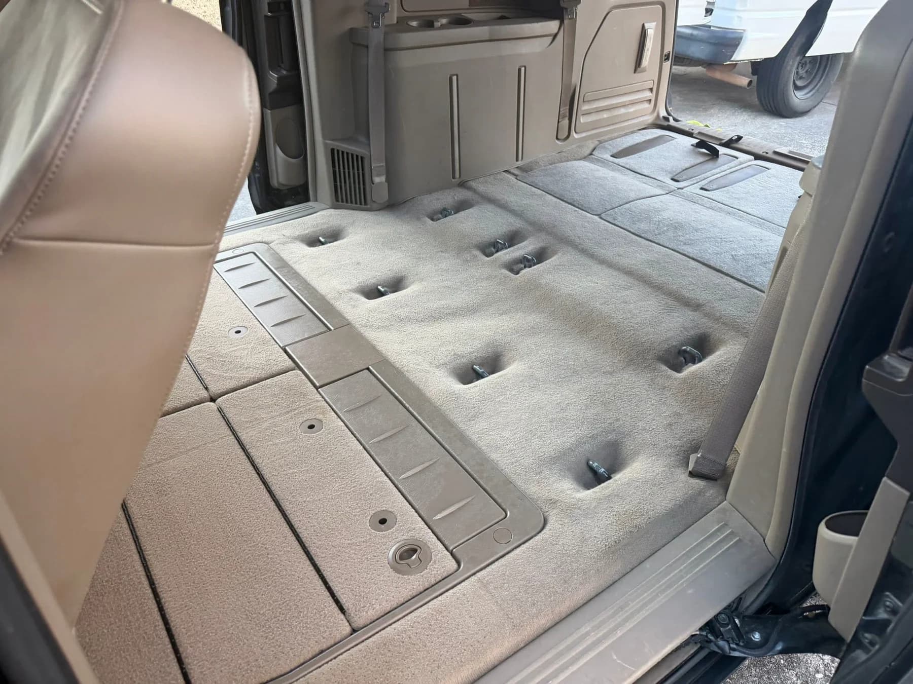 Freshly cleaned vehicle carpeting and interior floor