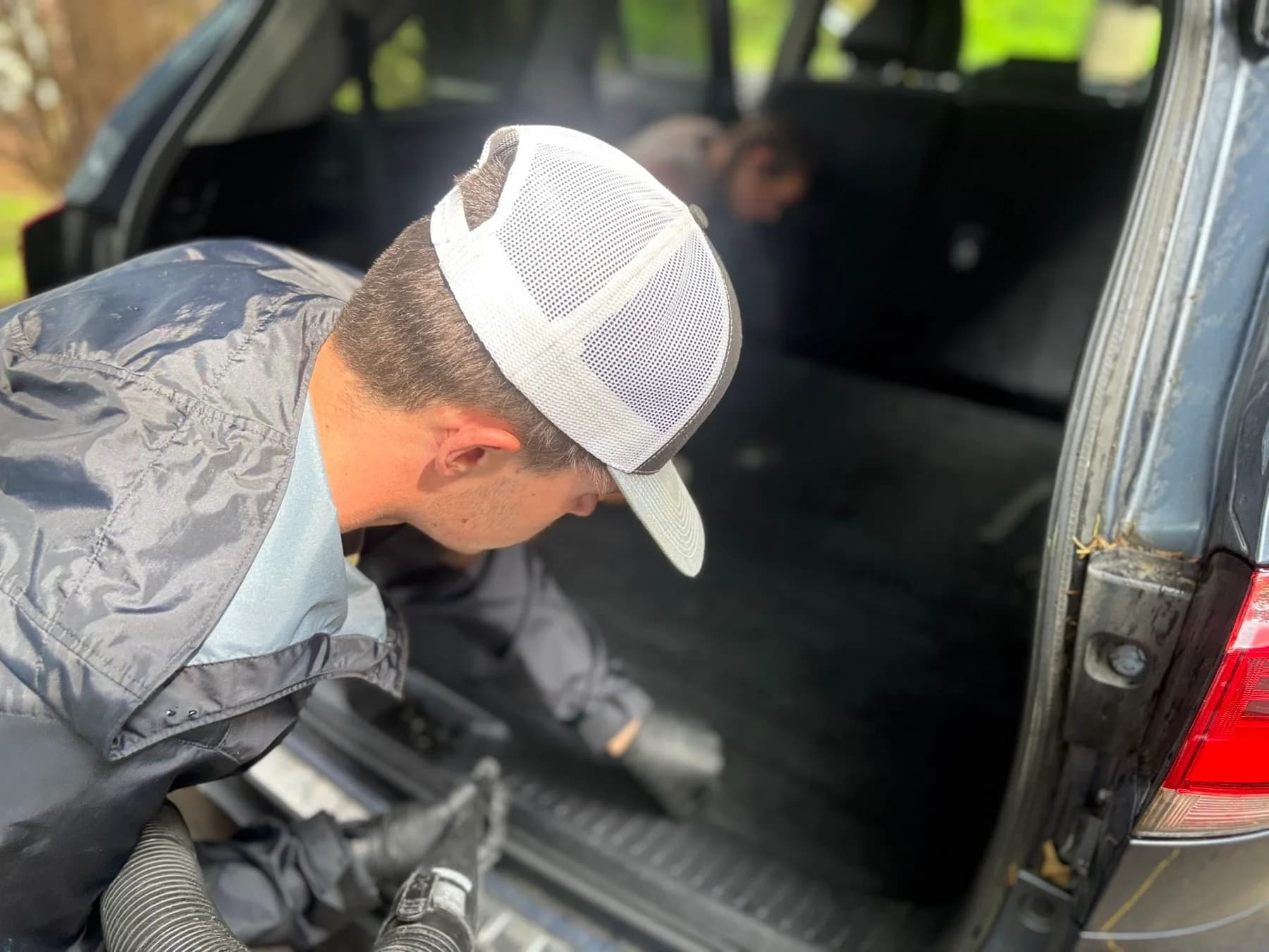 Nick working on a vehicle interior